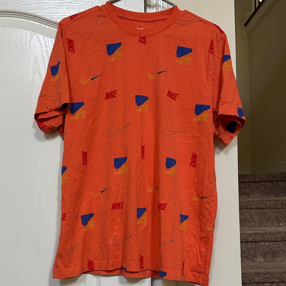 Nike Men's Orange Tee with Blue and Yellow Accents